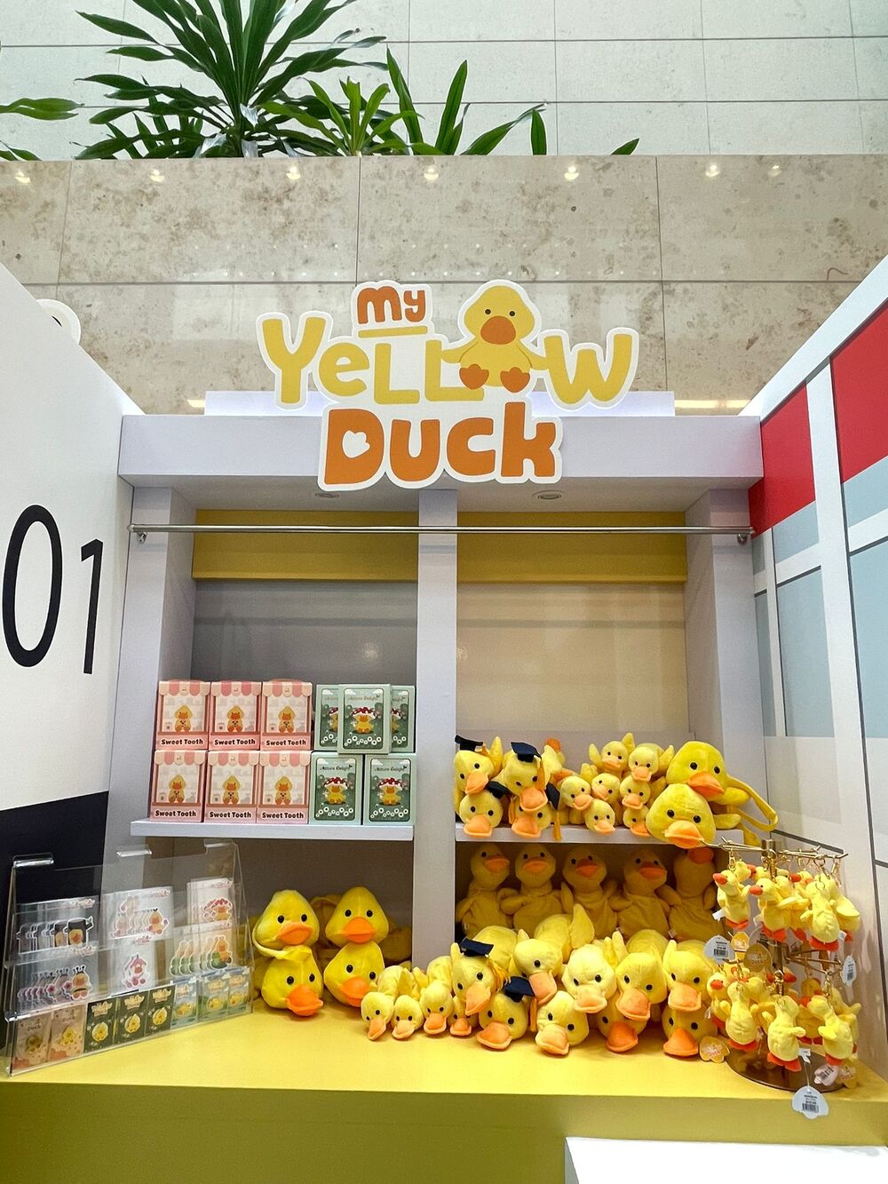 My Yellow Duck store shelf with boxed collectibles and plush