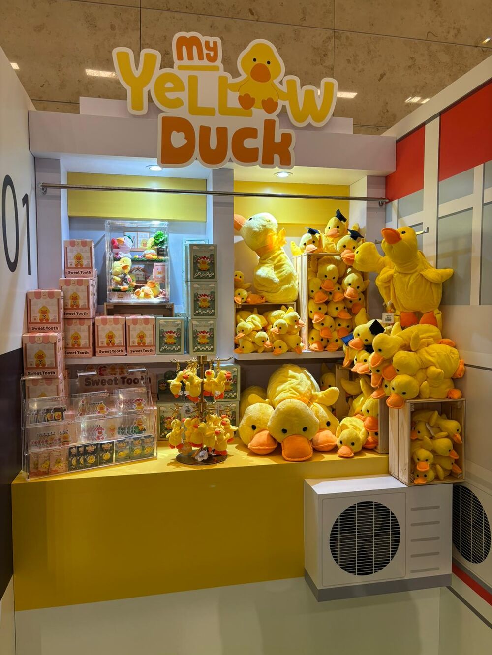 My Yellow Duck retail booth stacked with plush ducks